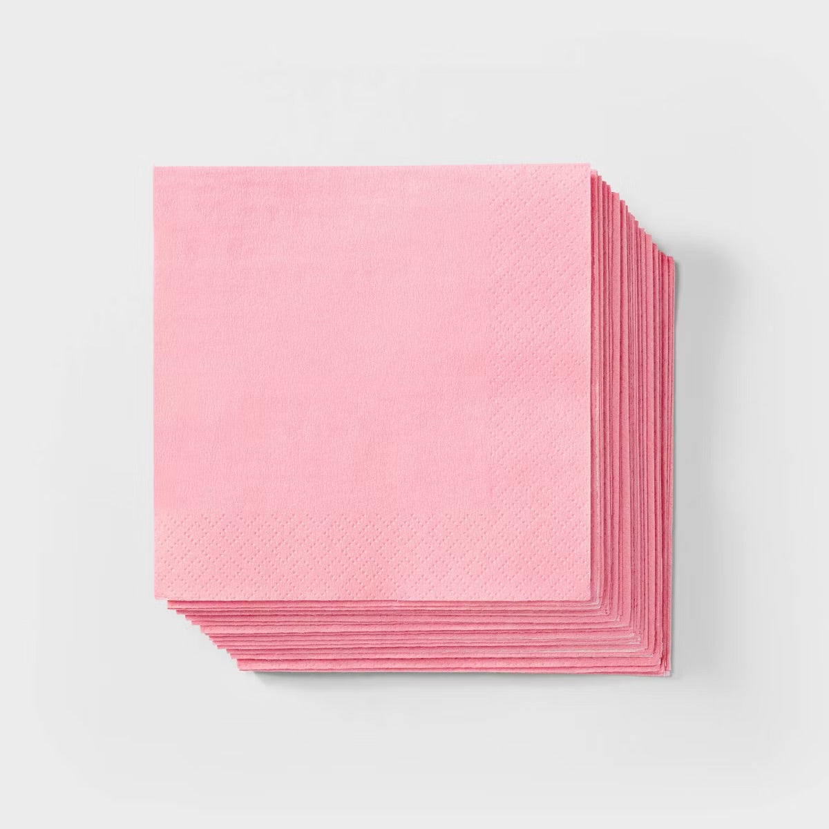 Stack of pink paper on a light gray background