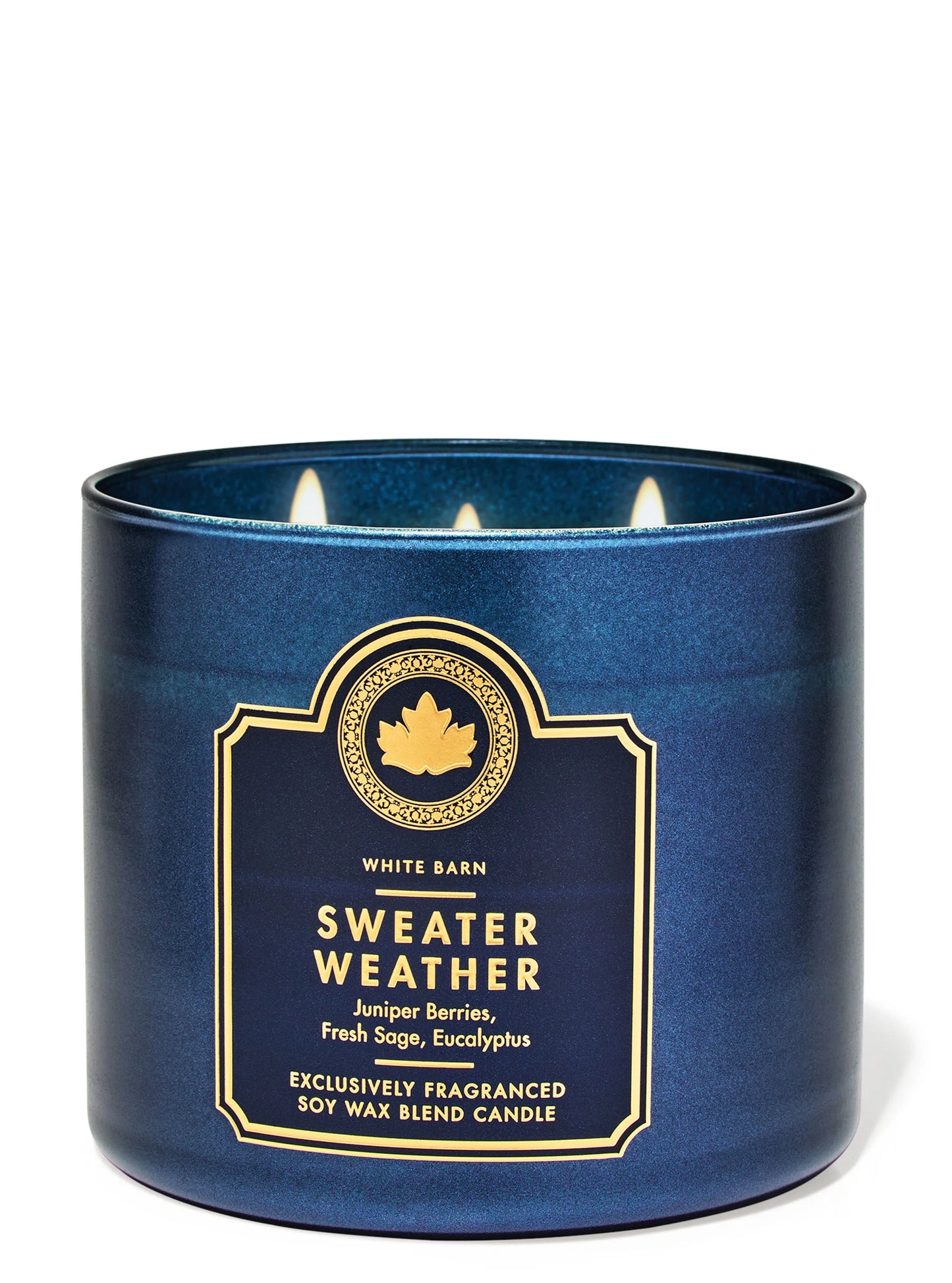 Blue triple-wick candle with a label on a white background