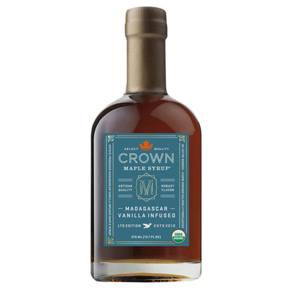 Bottle of Crown Maple Syrup with a sea lagoon blue label on a white background