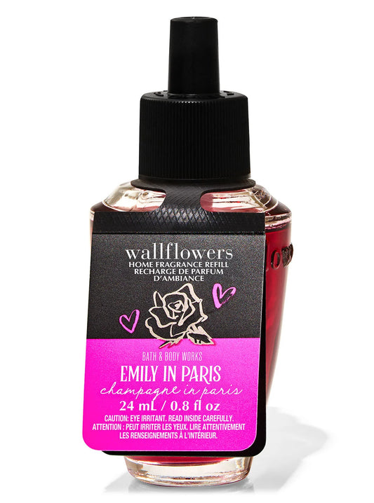 Wallflowers home fragrance refill bottle with black cap and pink label on a white background