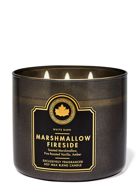 Black candle with gold label on a white background