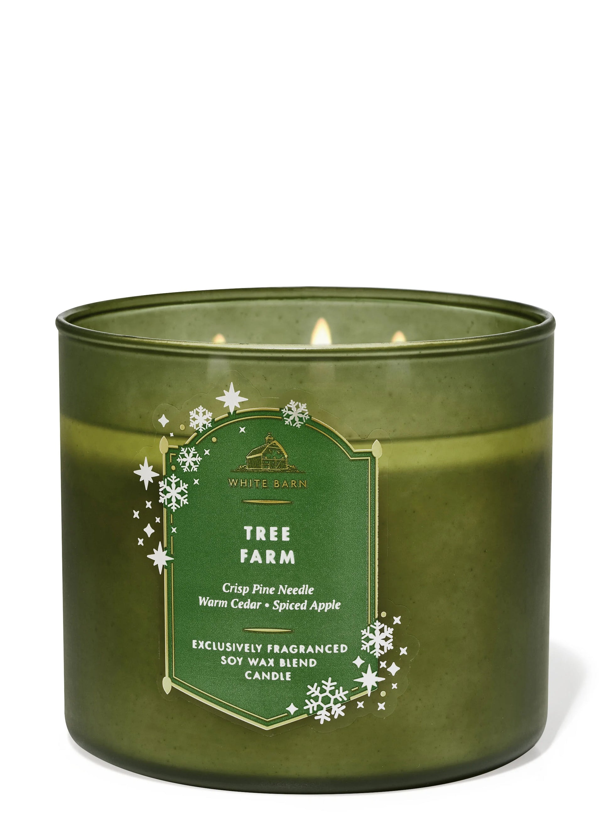 Green candle with a label on a white background