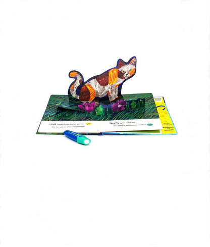 3D cat figurine on a book with an interactive pen on a white background