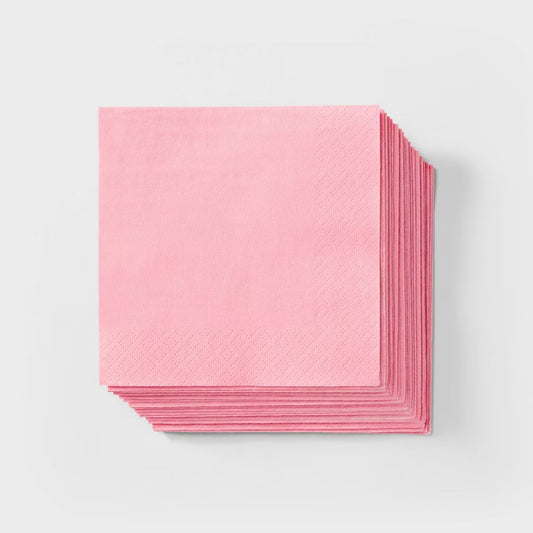 Stack of pink paper on a light gray background