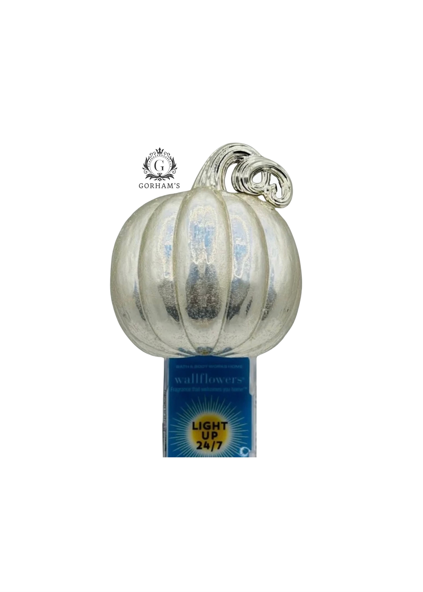 Decorative glass pumpkin with a label on a white background